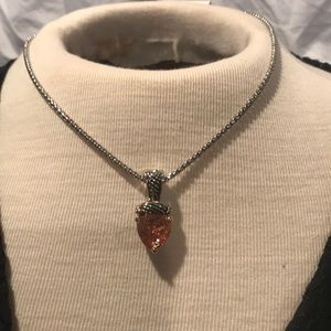 Heart  shaped pendant w/ amber colored stone